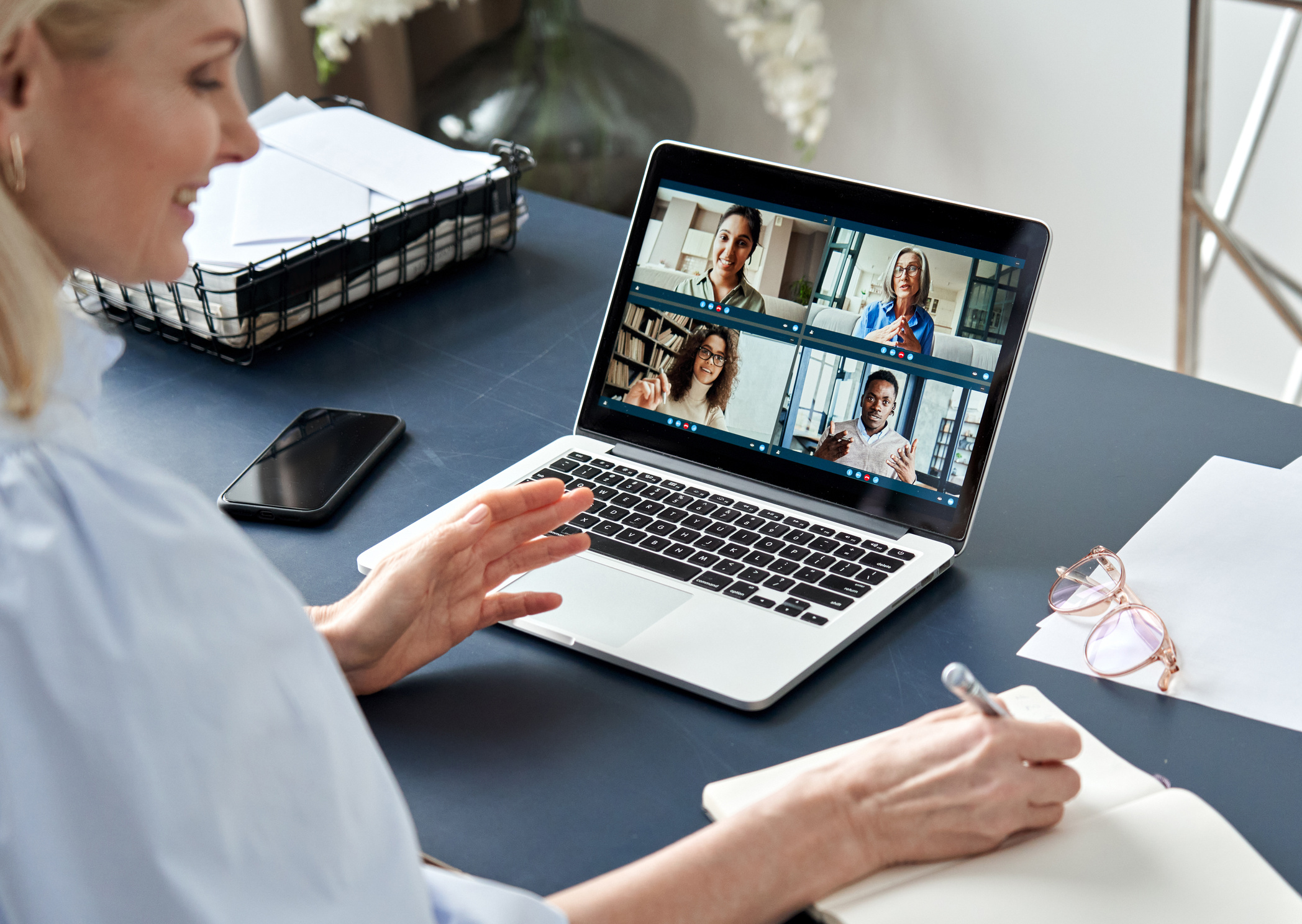 Businesswoman Having an Online Meeting with Colleagues